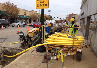A Laclede Gas crew runs new plastic lines in Maplewood.