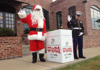 Santa and a US Marine help kick off Toys for Tots in Maplewood.