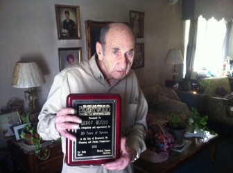 Leroy Russo with his retirement plaque from the city. He served on planning and zoning for 20 years. 