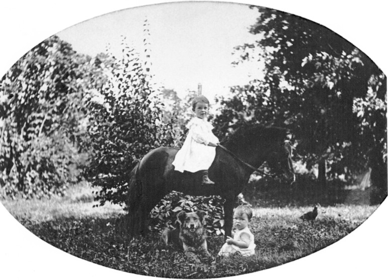 Charles Cartmell, age 2 1/2 and M. Warder, age 1 with their pony and dog who shall remain nameless.  No doubt named after   