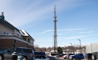 The antenna tower for the East Central Dispatch Center rises above the Richmond Heights Police Department.