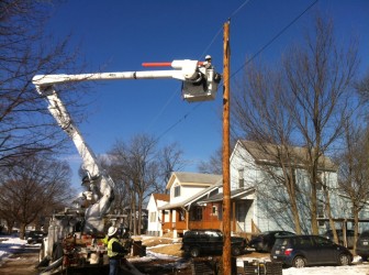 Ameren workers replace a pole on Comfort Ave. in Maplewood after a 1-car accident.