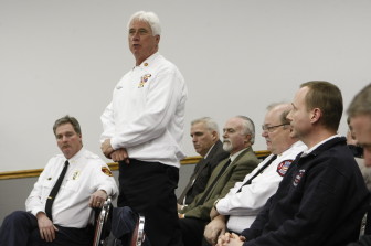 Richmond Heights Fire Chief Kerry Hogan speaks in favor of ECDC. Maplewood Fire Chief Terry Merrell (right) also came to support it, along with other area city fire  and police chiefs.