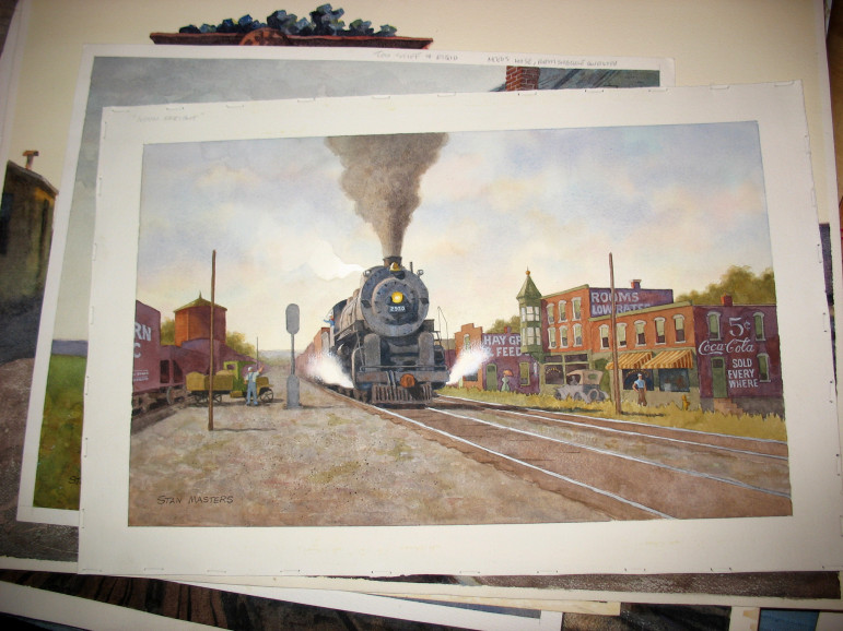 A stack of Stan's paintings with "Noon Freight" on top.