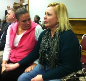 Brentwood dispatcher Judy Coleman is consoled by friend, Lisa Beckman after the vote. 