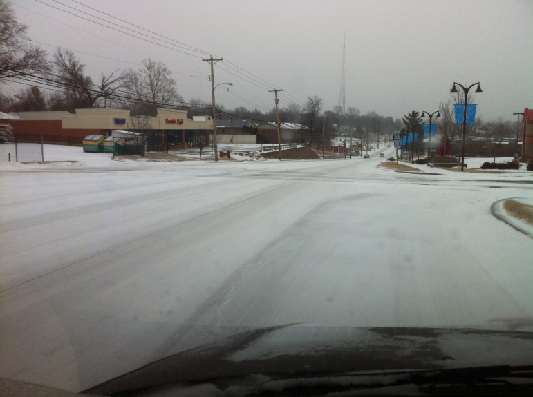 Manchester Road east of Brentwood Boulevard was packed snow and sleet Sunday morning.
