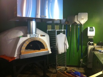 The oven at A Pizza Story is ready to cook.