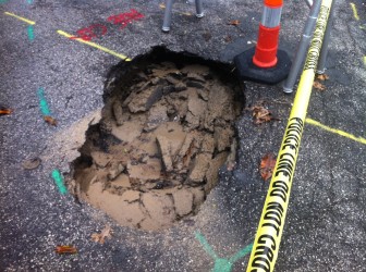 The sink hole appears to have grown since it opened up in April.