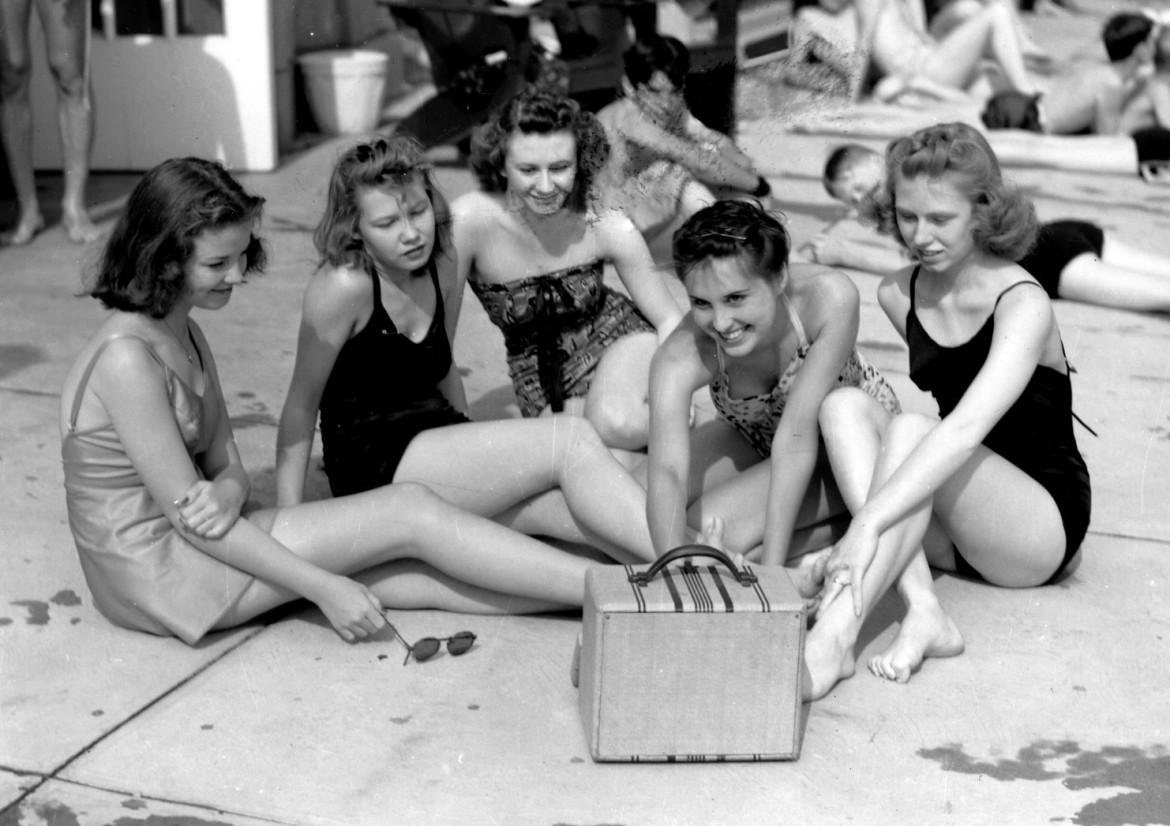 I'll wrap this up with one of the best photos in our historic photo inventory.  This is just a great photo taken by the well known Maplewood original, Elmer Wind Jr.  For those young enough to not know what is happening, this bevy of poolside beauties are playing a battery operated radio.  the battery is those days weighed about as much as the one in your car does now.