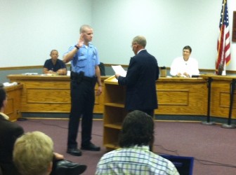 Brentwood Police officer, Geoff Presson, is  sworn in by Mayor Pat Kelly.