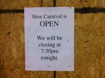 Shoe Carnival boarded up and closed early Tuesday.
