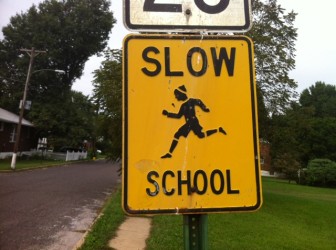 On the 8900 block of White Avenue, the signs say, "Slow - School"