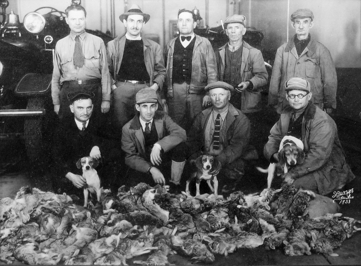 In addition to door-to-door soliciting for canned foods and money, a rabbit hunt was another method they used to feed their neighbors.  They cooked the food at the firehouse and then delivered it to shut-ins and needy folks.  This photo is from 1933, at the height of the depression.