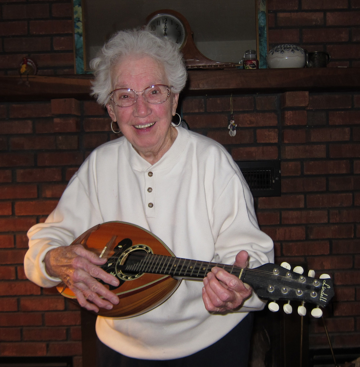 Satisfied customer, Jane Houser strums her mandolin purchased at Kennedy Music in the early 1970's.