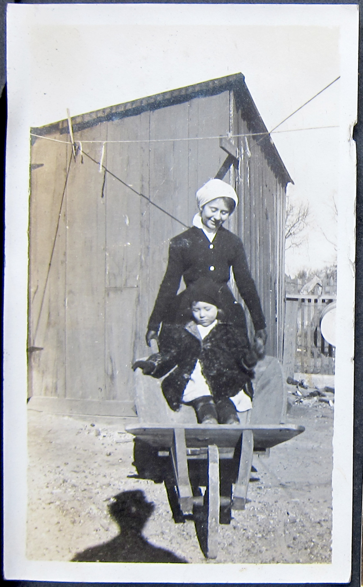 Amongst the Irwin collection are scenes from possibly two family farms.  These first four images are on the pages that contain photos from Talitha's pre marital life.  Here we have an unidentified woman wheelbarrowing an unidentified child.  the only thing I can say for sure is that is a wheel barrow.