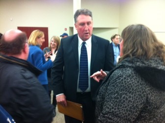 Candidate Mark Wilson talks with a resident after the forum.