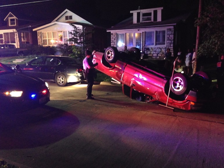  A truck flipped in the 1400 block of Bredell following a police chase. Photo by Scott Smid