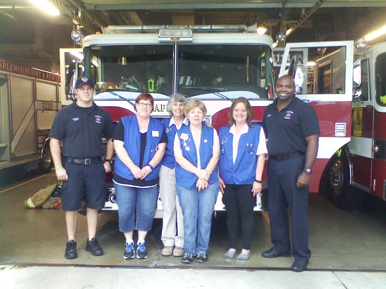 Lions Auxiliary Ladies Karen Bish, Eileen Lencz, Kathy Lubbers and Heidi Barks (left to right) fed Maplewood firefighters and police dinner Wednesday night.