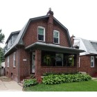 A cute covered porch welcomes you to 7147 Wise Avenue. This upda