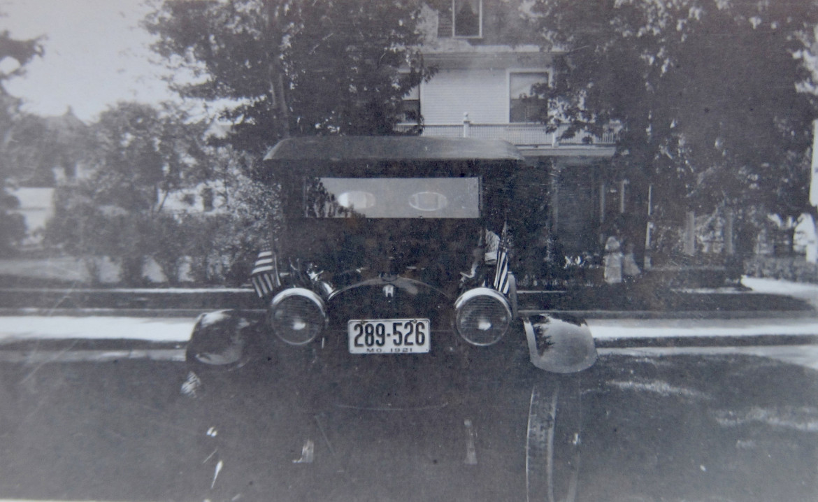 Looks like a very nice Fathman car in the driveway. It's easy to date this photo. 1921. Looks like a special occasion, possibly 4th of July.
