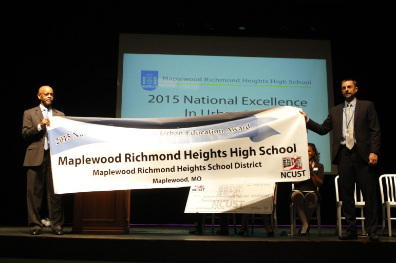 Dr. Joseph Johnson, of the NCUST and MRH Principal Kevin Grawer with the banner for MRH High School