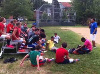 MRH soccer coach Ryan Robertson talks to the team at a practice at Ryan Hummert Park.