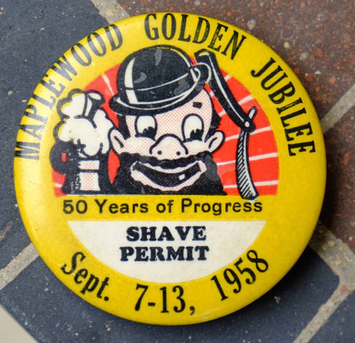Marty has a large collection of Maplewoodiana. He let me photograph several examples like this button from the 50th anniversary of our town.