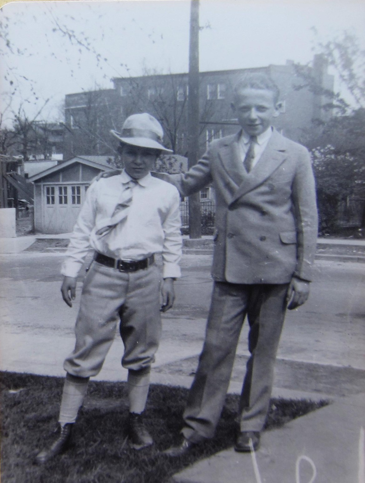 Two of the young fellows pose in the side yard with a view of the Masonic Temple in the background. the temple fronted on Manchester. Courtesy of Martin Fischer.
