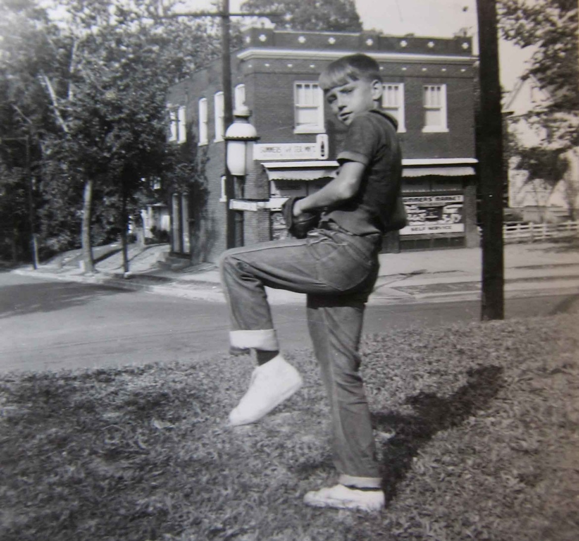 Let's start with this photo because it has a good view of the building. The young man, probably a neighbor, is Chester Rose and the year is 1955.