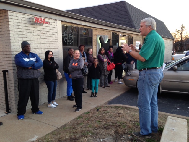 Gus's Fried Chicken in Maplewood owner Jim Zimmermann talks to the waiting crowd on Wednesday.