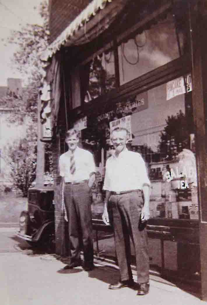 An undated image of Martin Fellhauer now considerably oder and John D. O'Brien in front of the store. The car is early 1930's.
