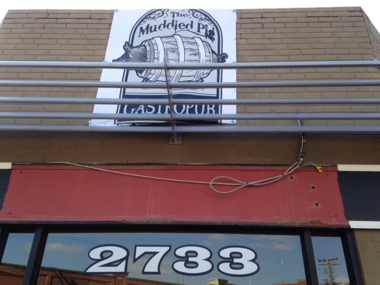 The Muddled Pig sign is up at 2733 Sutton Boulevard.