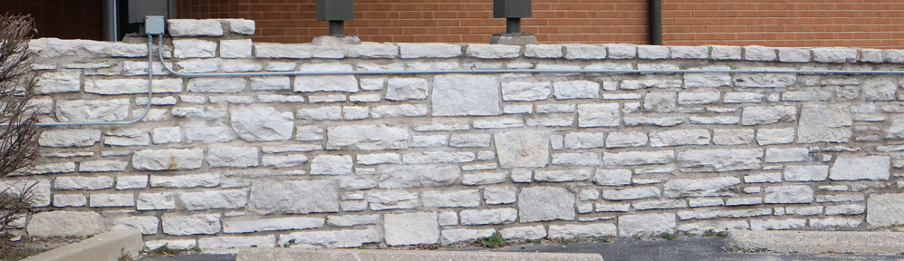 This is one of a lovely pair of stone walls that flank either side of the J.B.Smith Funeral Parlor AKA the Sarah Sutton Harrison historic home at 7456 Manchester.