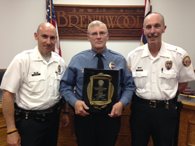 Assistant Police Chief Jim McIntyre (left) and Police Chief Dan Fitzgerald (right) with Walter Kohler, recognized for 30 years of service.