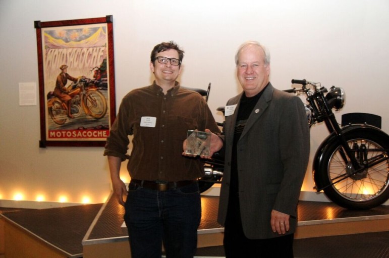 Nick Frisella (left) and Ralph Bicknese accepted the award as volunteer members of Maplewood’s Sustainability Commission. 