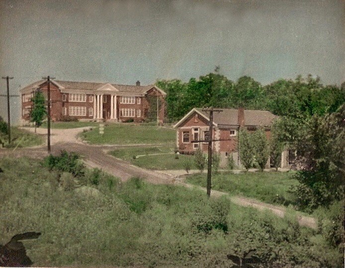 This photo was taken in the late 1930s by Ed Beekman, who lived in the house visible in the photo. The view is from Bridgeport Avenue looking west toward BHS. The Beekmans’ house was completed in 1930, 3 years after the original BHS building, and is still standing. At one time, it served not only as the Beekmans’ residence but as a luncheonette-confectionary for BHS students. The young, bright-green tree in the front lawn of the high school near the left edge of the photo is the post oak.