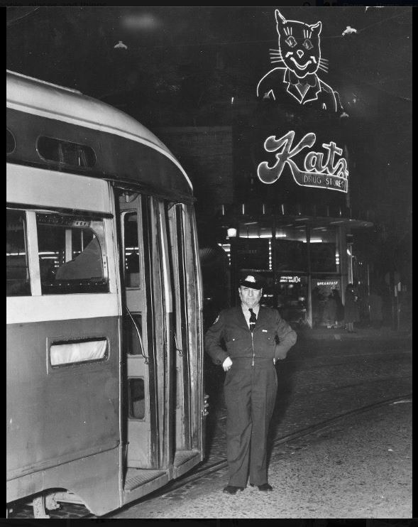 A night time view when the electric streetcars were still running. Also from 1949 which is the year the tracks were paved over after the service ended. I can't say for certain where this image was found. 