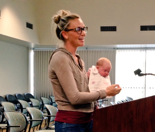 Abby Bolyard with her one-month-old daughter at the Maplewood Planning and Zoning Meeting