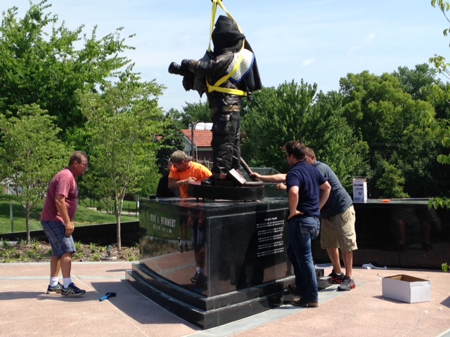 The Ryan Hummert sculpture is positioned on the memorial on Wednesday.