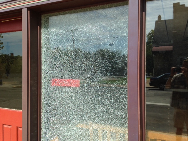 Shattered window at a business on Sutton.