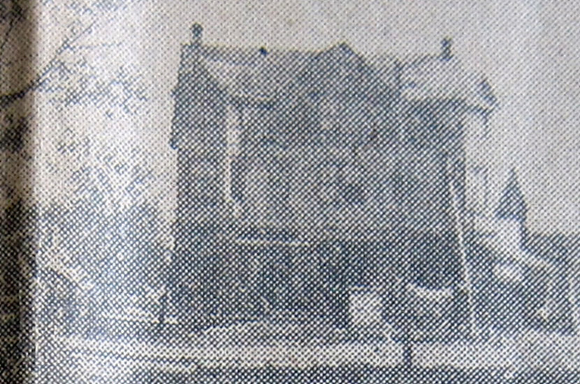 the image quality is poor due to its being a newspaper photo. as you can see thie image is of what looks to be a three story frame building.