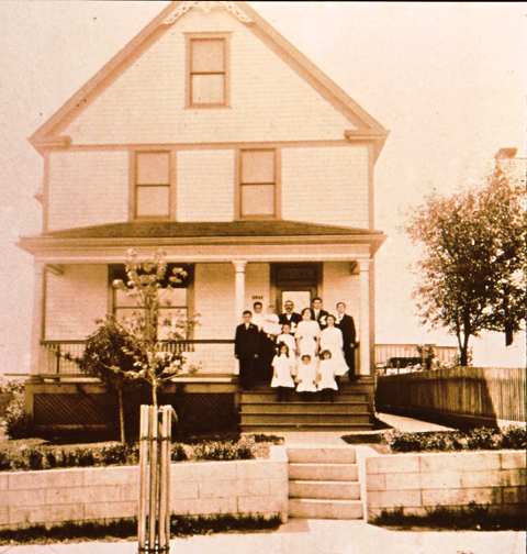 So where are the ghosts? There they are on the front porch. They weren't ghosts when this photograph was taken but you folks that will be inhabiting they're home take a good look at them. they may come back trying to figure out just what is going on. Courtesy of the Maplewood Public Library.
